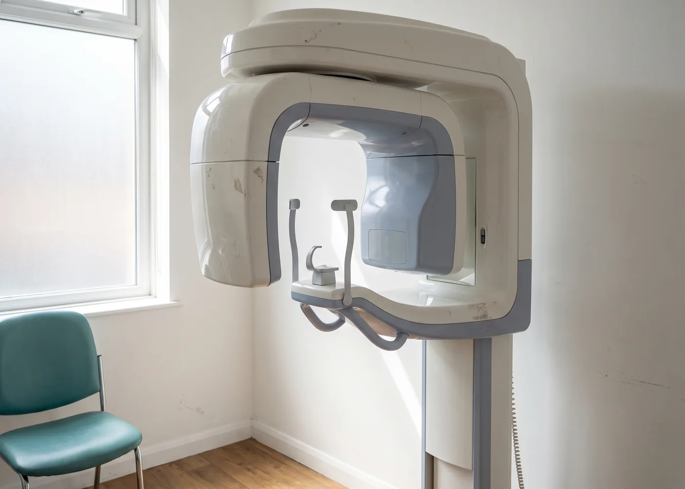 A CBCT scanner in a bright treatment room